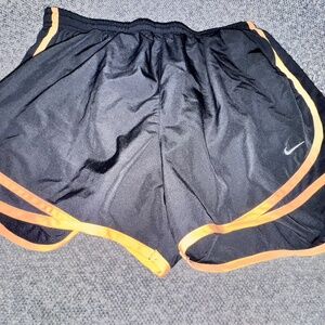 Women’s Black and orange Nike running shorts embroidered logo